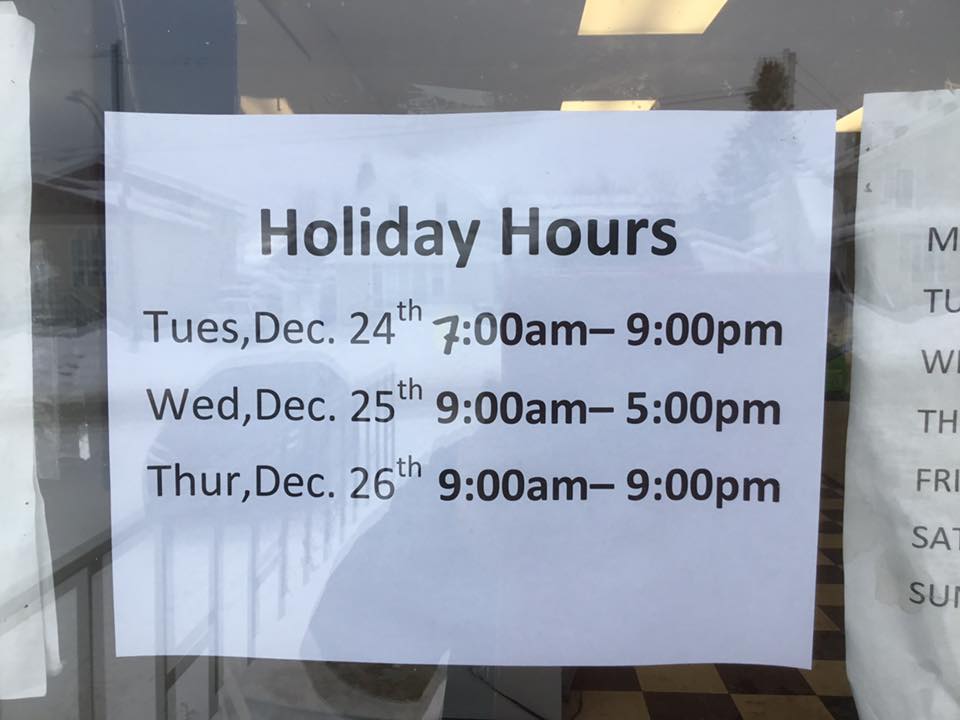 Holiday hours notice posted on door
